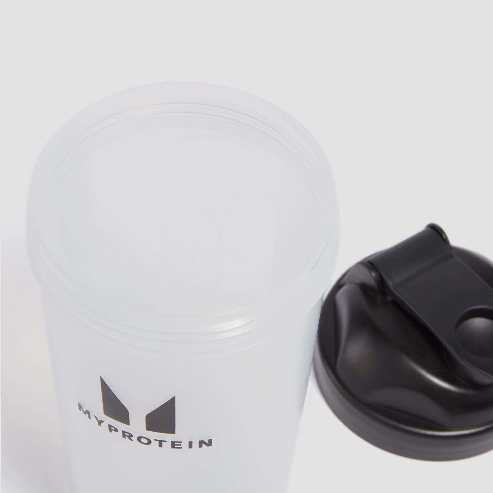 Clear shaker bottle with black lid and logo.