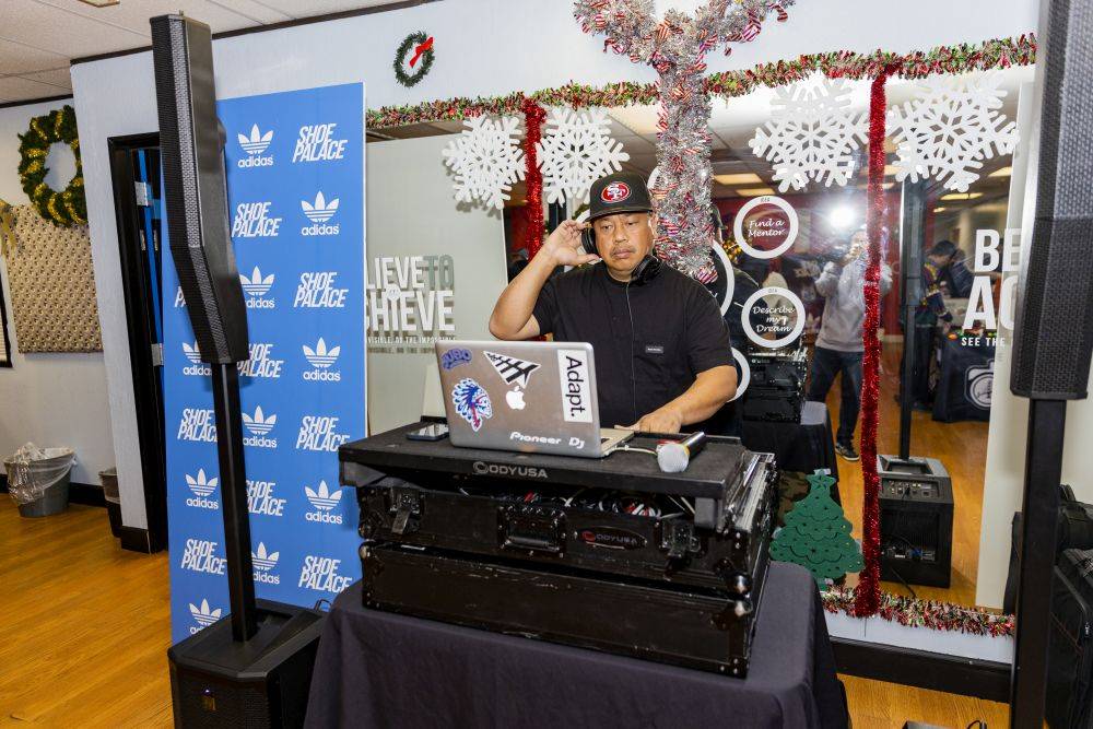 the dj at sp x adidas christmas party