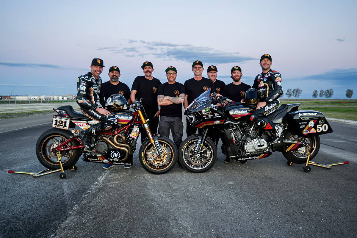 rsd team racers standing next to their race bikes