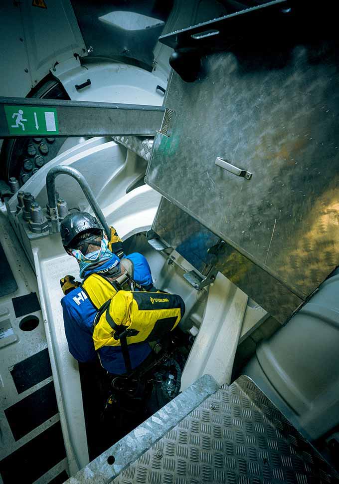 A view of the tight industrial space inside a wind turbine.