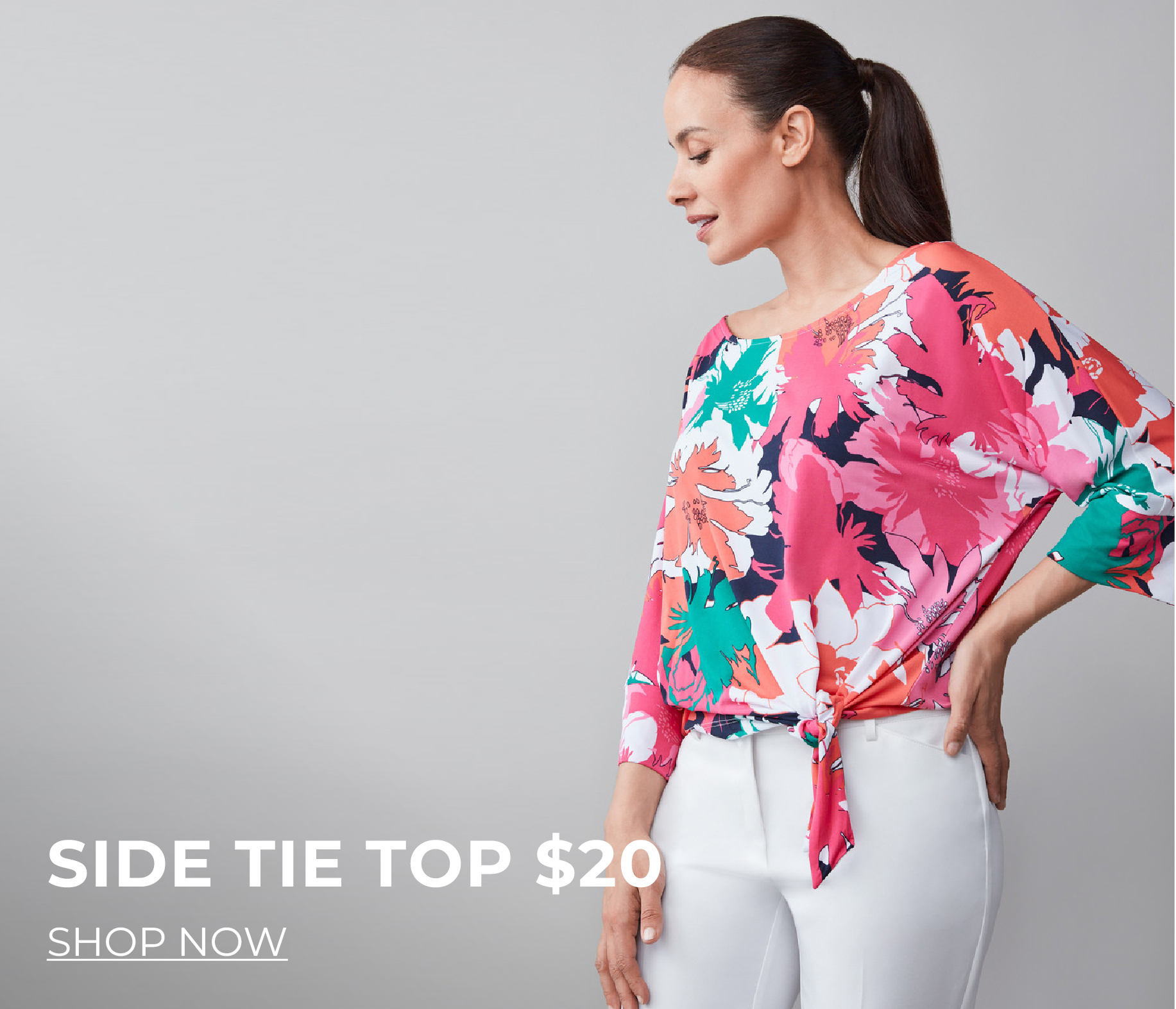 Woman in colorful top with side tie, promoting $20 sale.