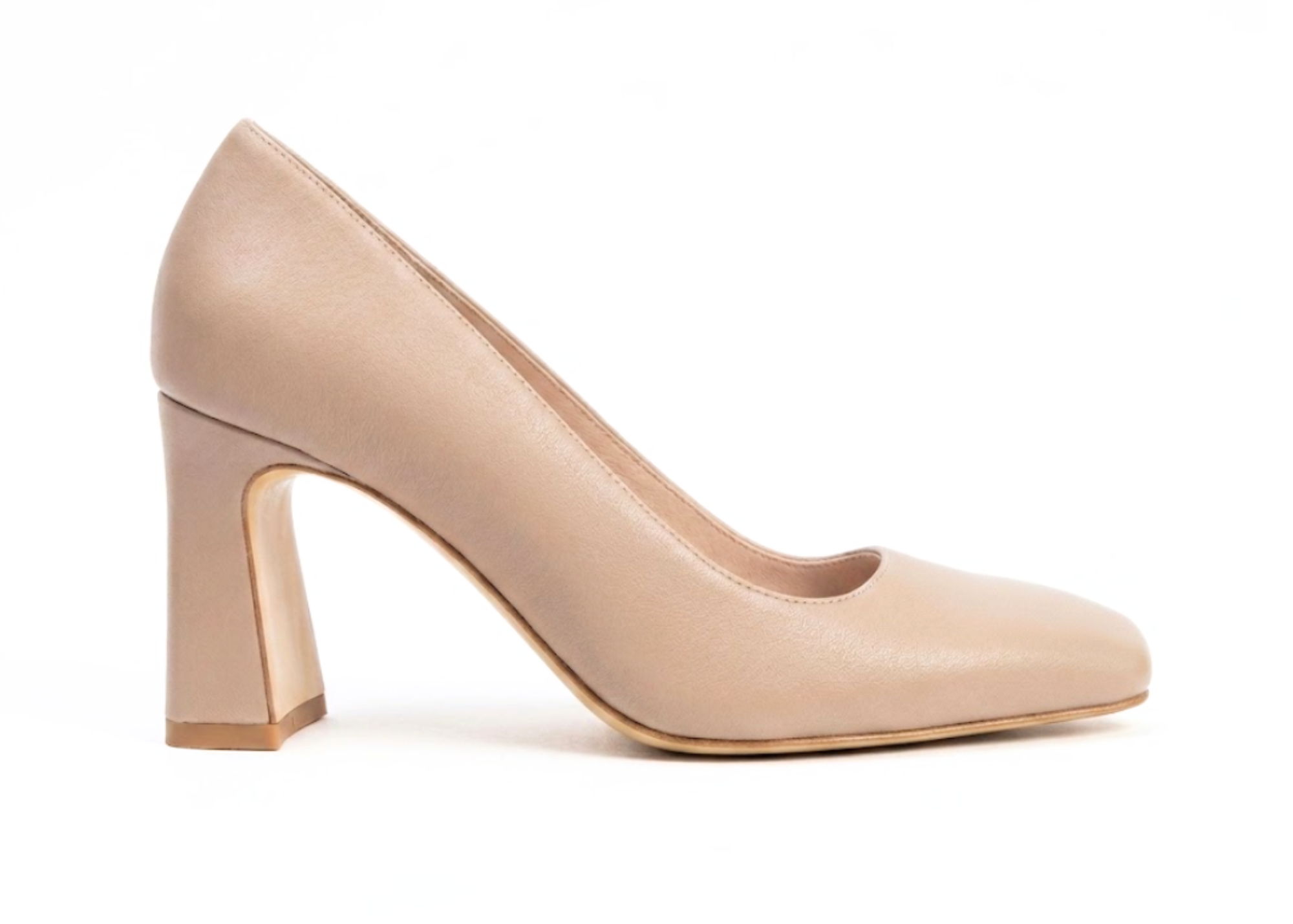 Beige high heel shoe with a chunky heel, side view.