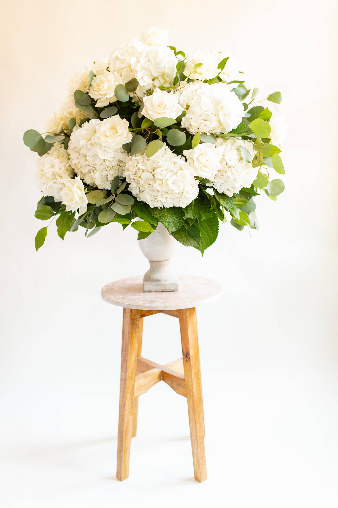 Hydrangea and Rose with salal and eucalyptus wedding ceremony urn floral arrangement