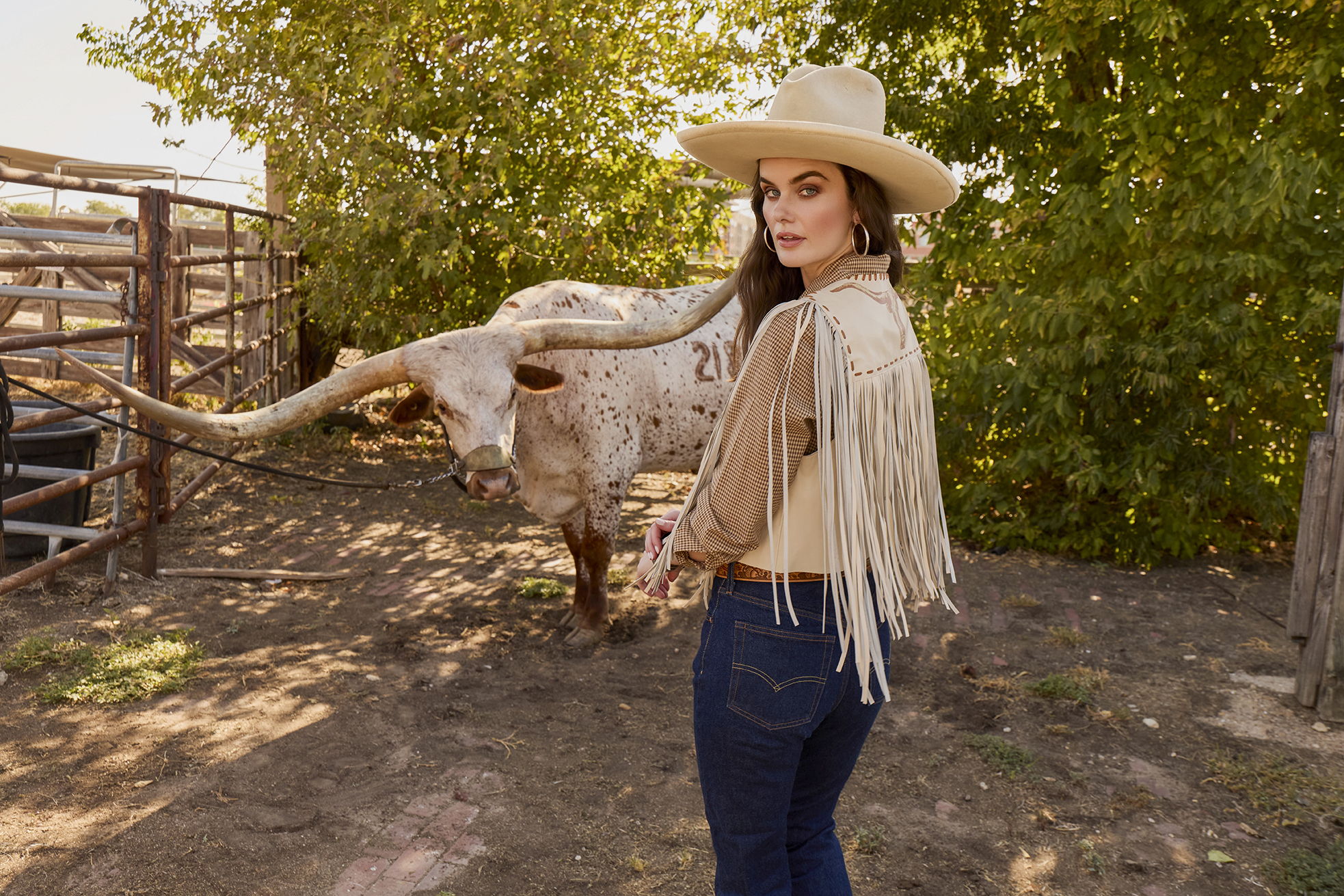 Kaylin wearing the Head on Vest with the McCoy Top and Double D Ranch jewelry and accessories.