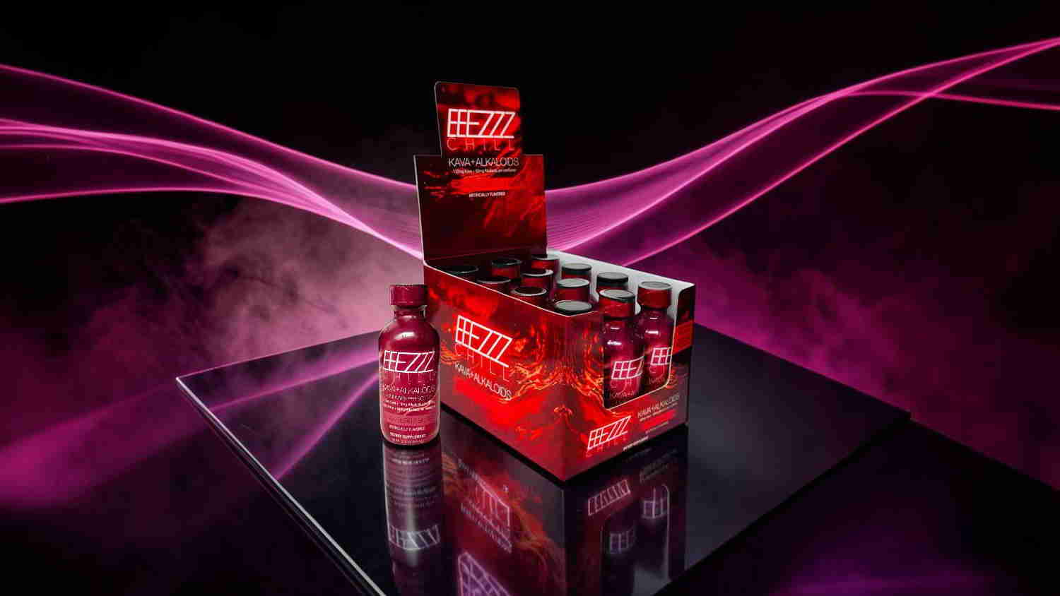 A display of energy drink bottles against a dark, colorful background.