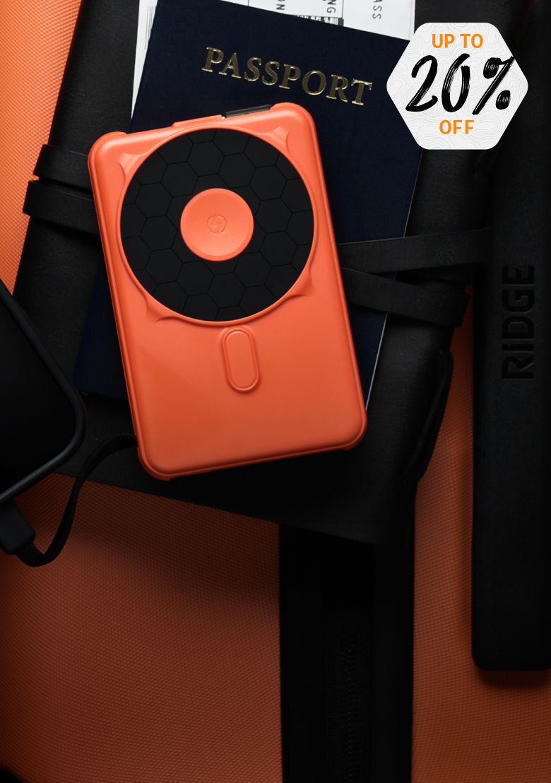 Orange wallet on a black strap with a passport and discount tag.