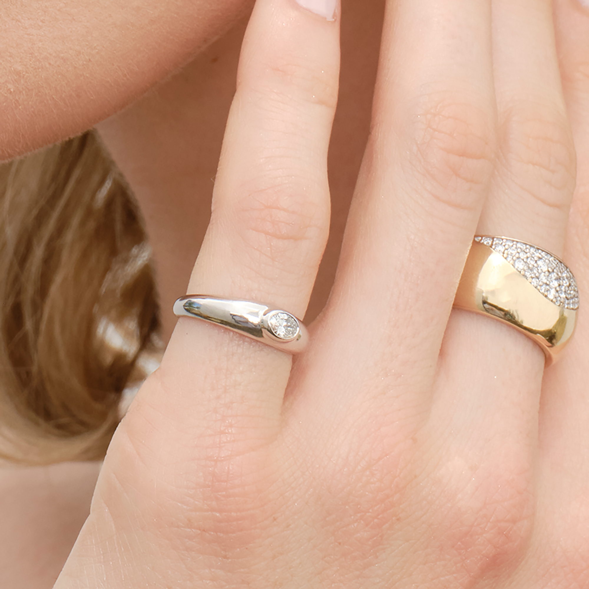 Gold ring with a central diamond.