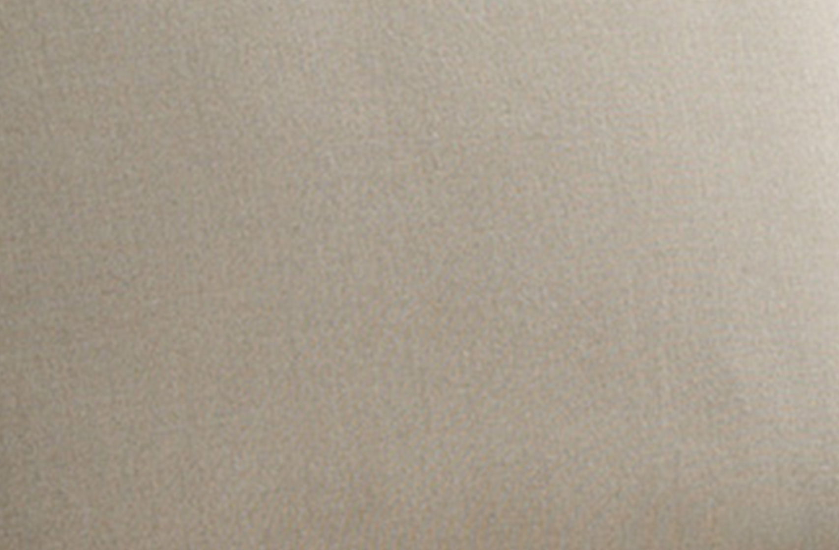 A plain, light beige textured surface.