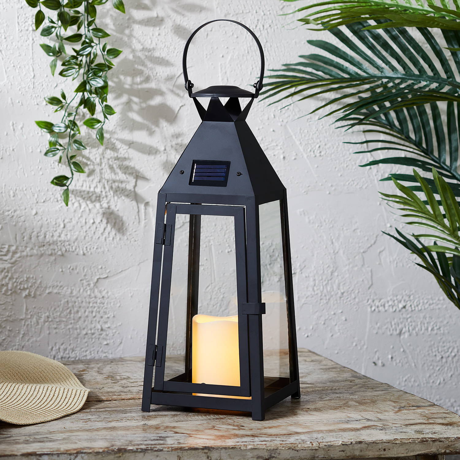Brisbane solar lantern sat on table in garden