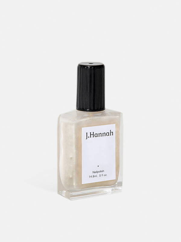 A product image of the J.Hannah pearly gold white nail polish called Akoya.