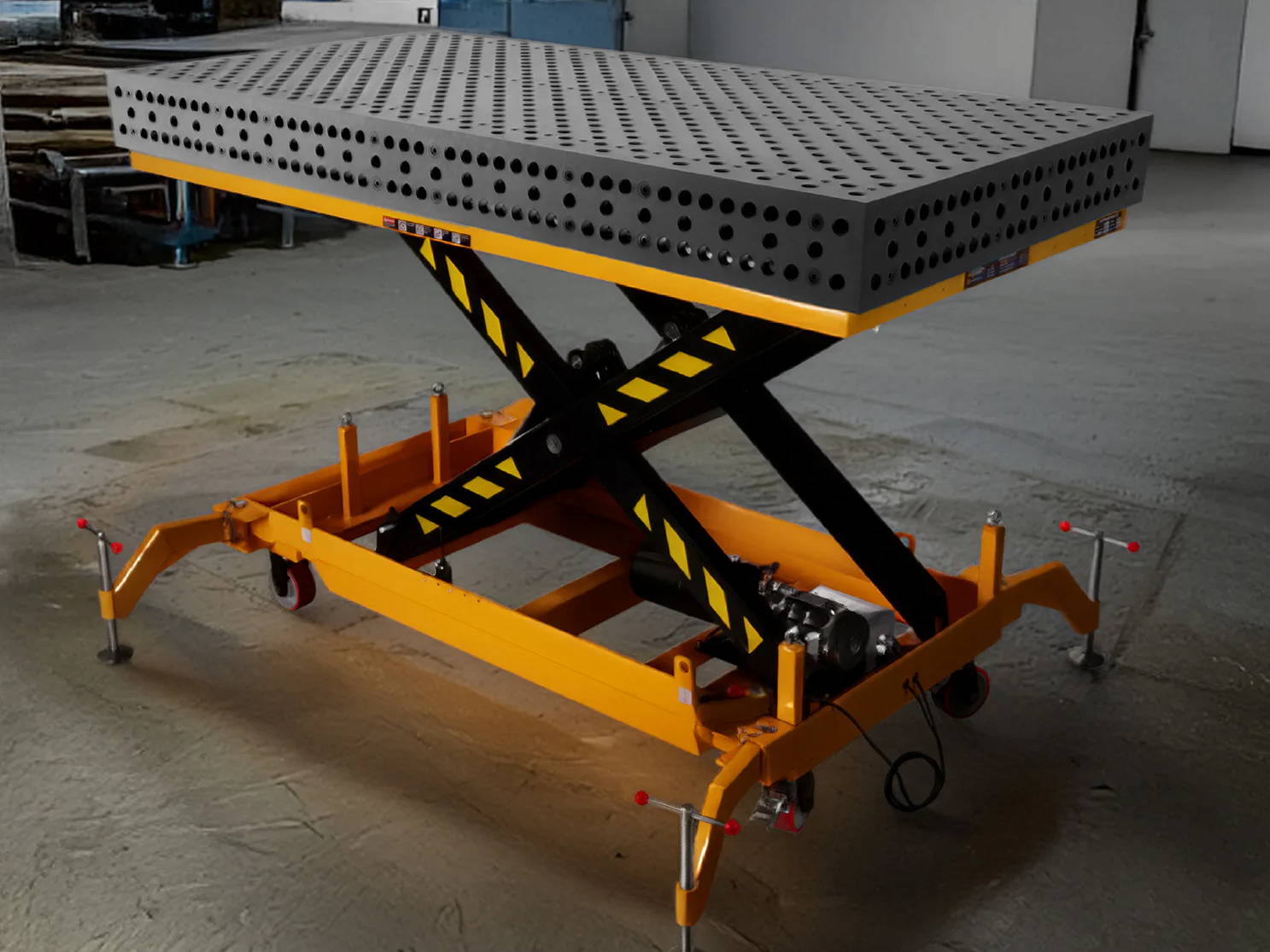 Scissor lift table with a textured surface in a warehouse setting.