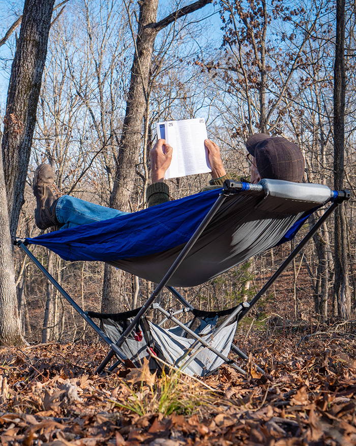 camping in the woods with portable free standing hammock