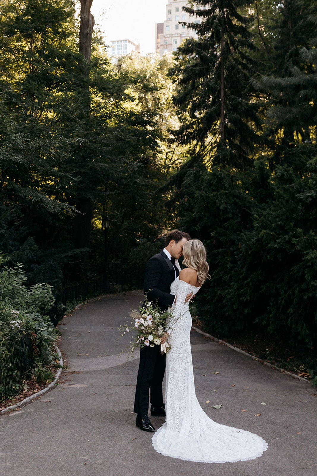 Bride and groom sharing a kiss in Central Park