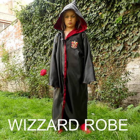 A little girl wearing a harry potter cape made out of black and red fabric