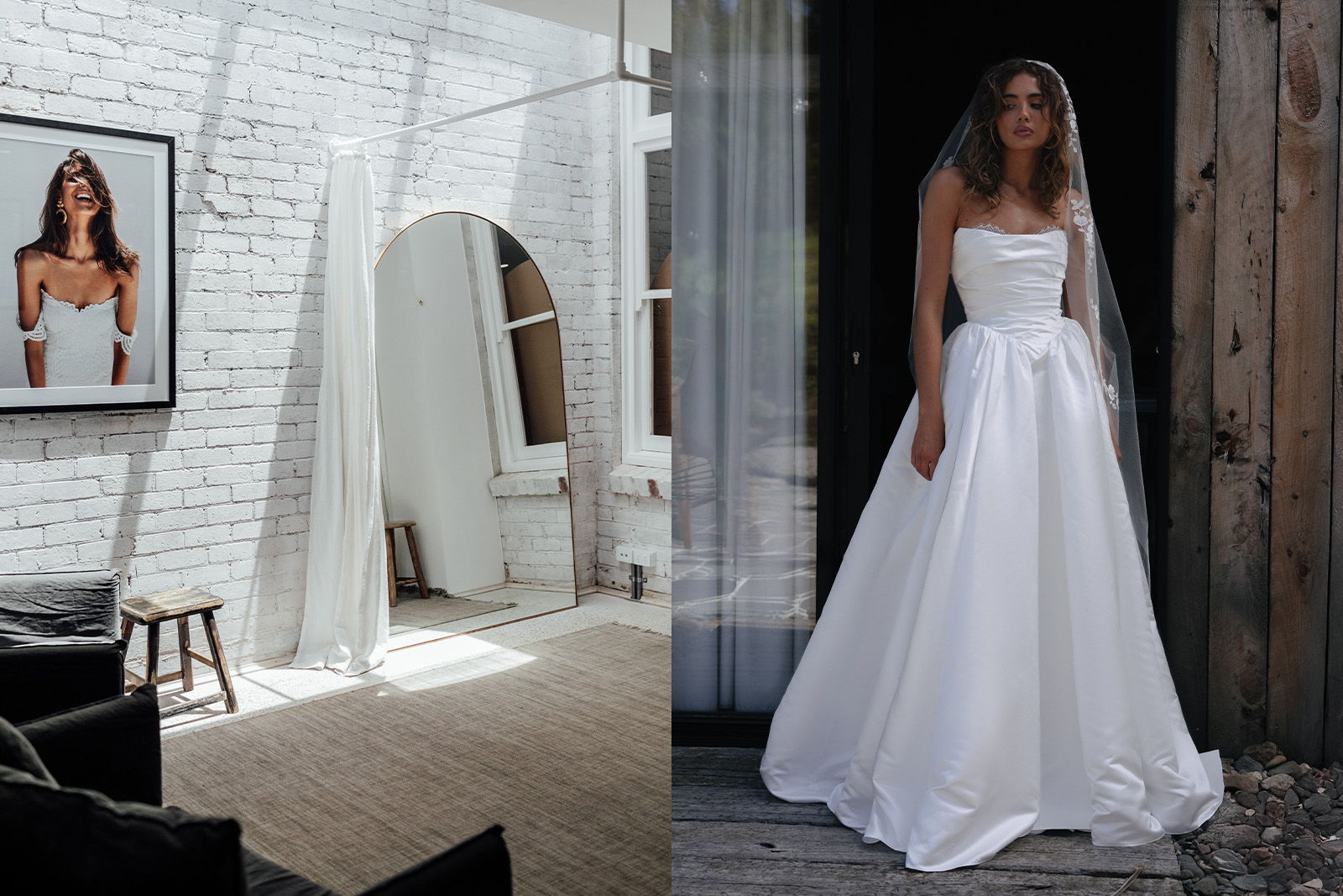 A bride in a white dress stands next to a mirror in a bright room.
