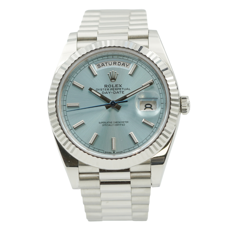 Silver watch with a light blue dial and date display.