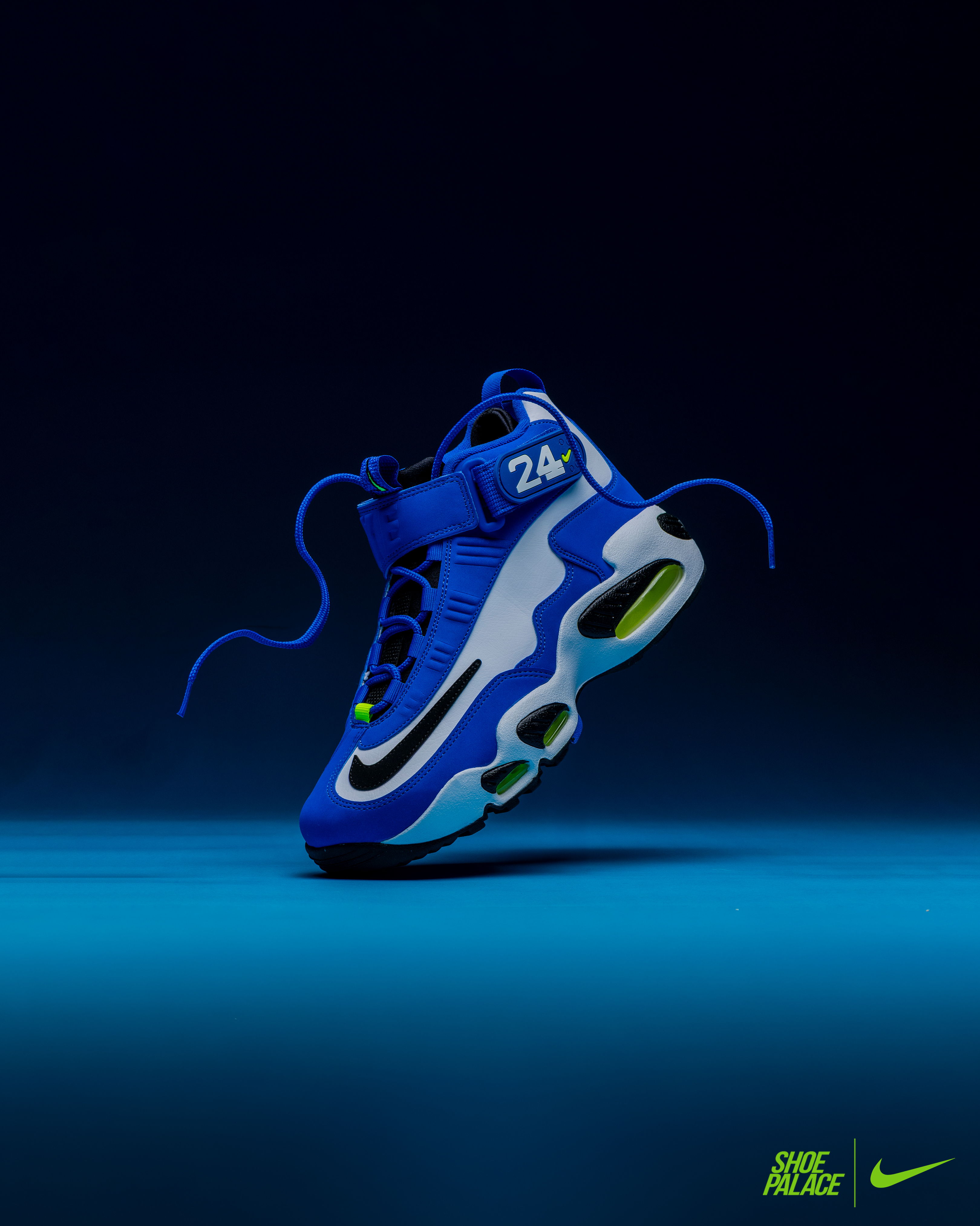 Air Griffey Max 1 Varsity Royal - Blue Nike basketball shoe floating on a blue background.