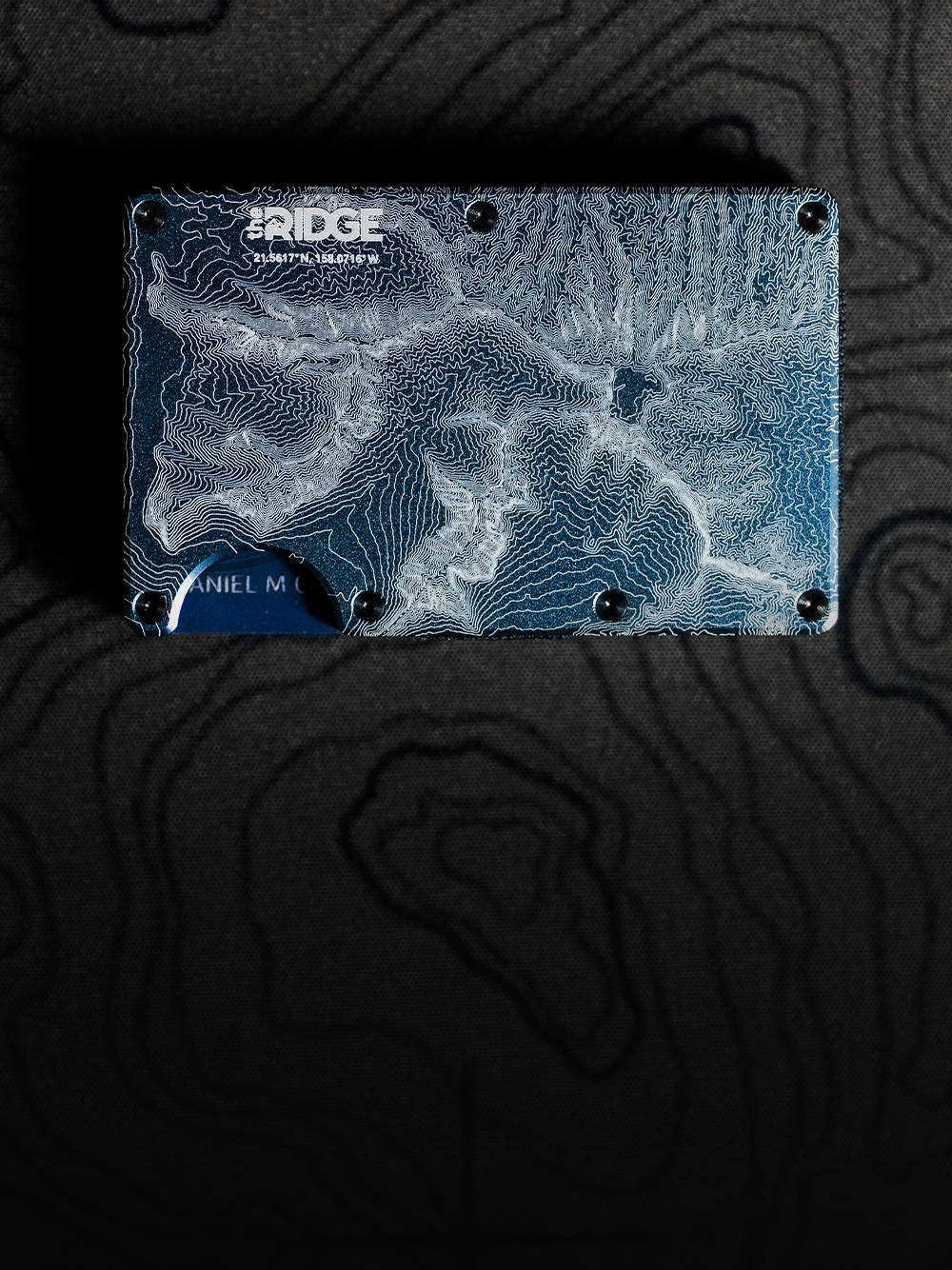 Limited Edition Ridge x Chael Sonnen Ridge wallet on top of garments