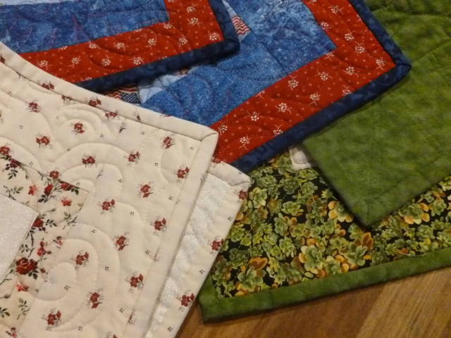 three different quilts with quilt binding