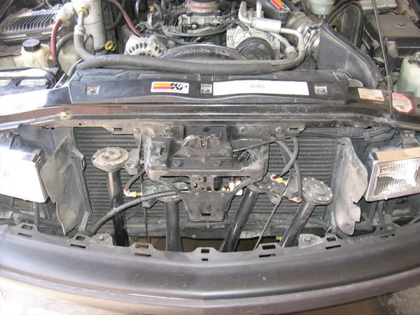 Wide front view of the Shocker XL horn installation behind the grille of Ron's 2000 Chevrolet S10, install photo 4