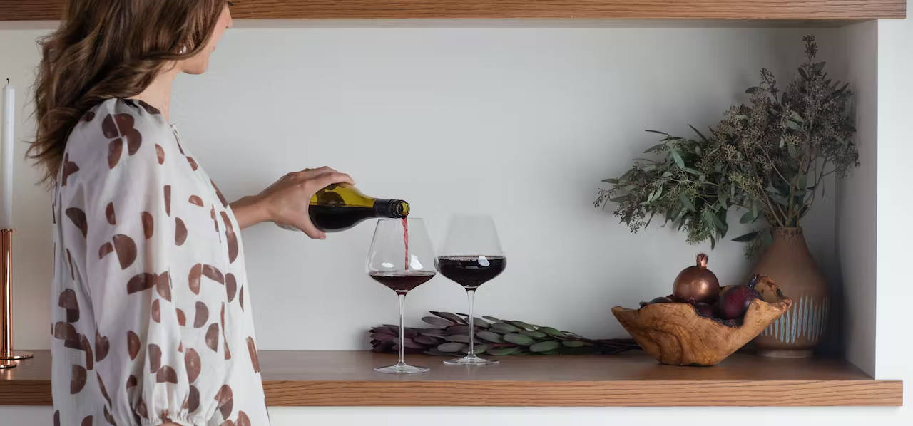 woman pouring red wine