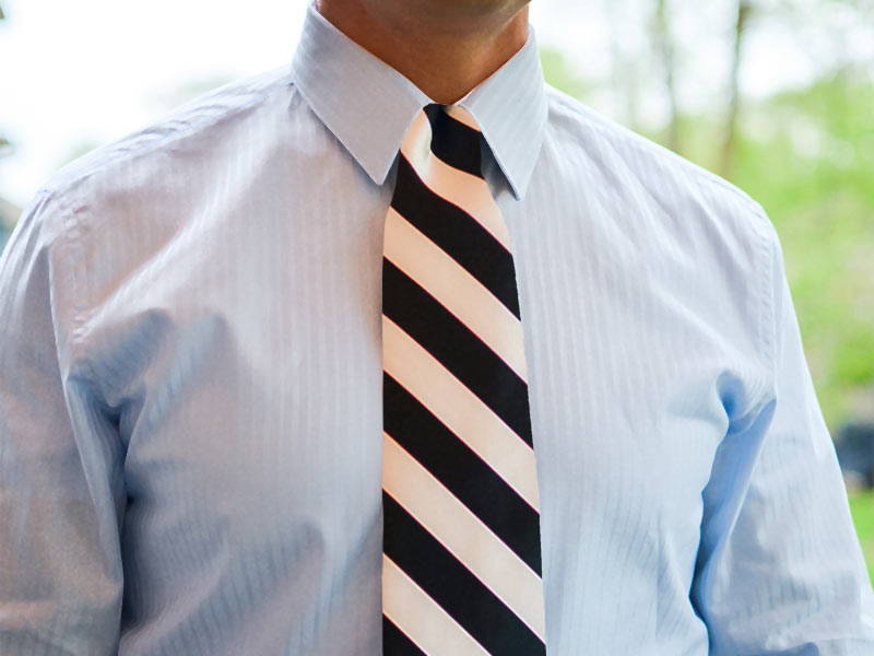 AI generated-like photo of a man wearing a black and white striped tie