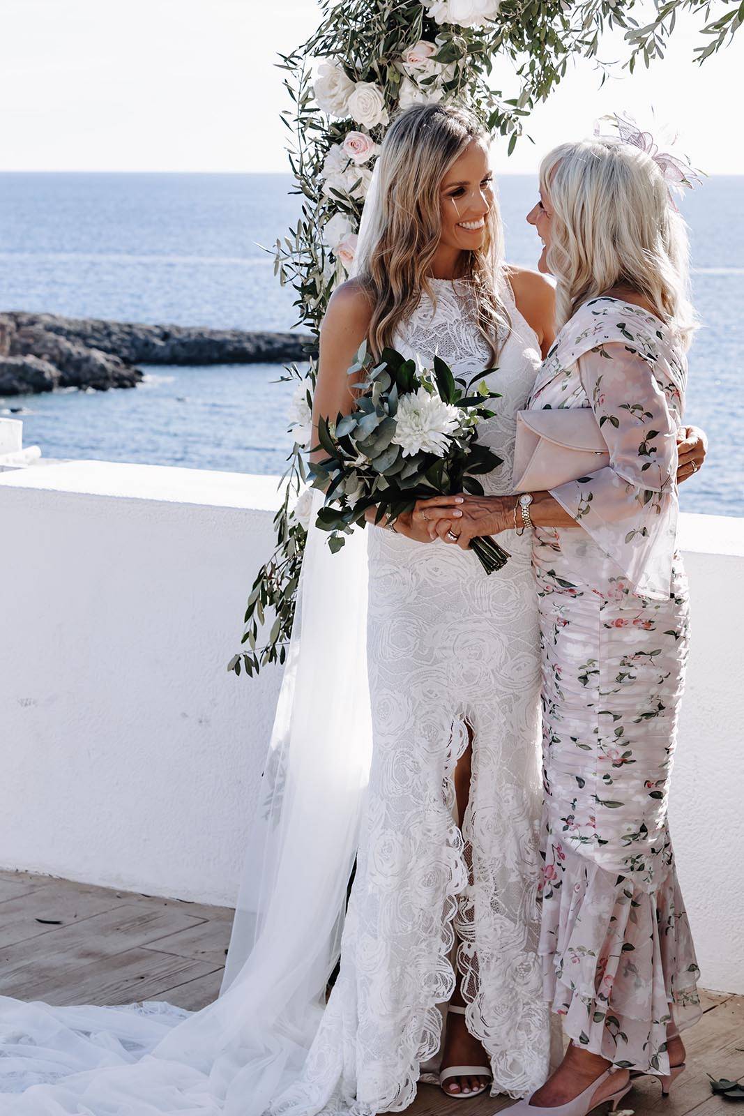 Bride, sharing a joyous moment with her mother