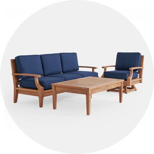 Navy blue outdoor sofa and chair with wooden frame and coffee table.