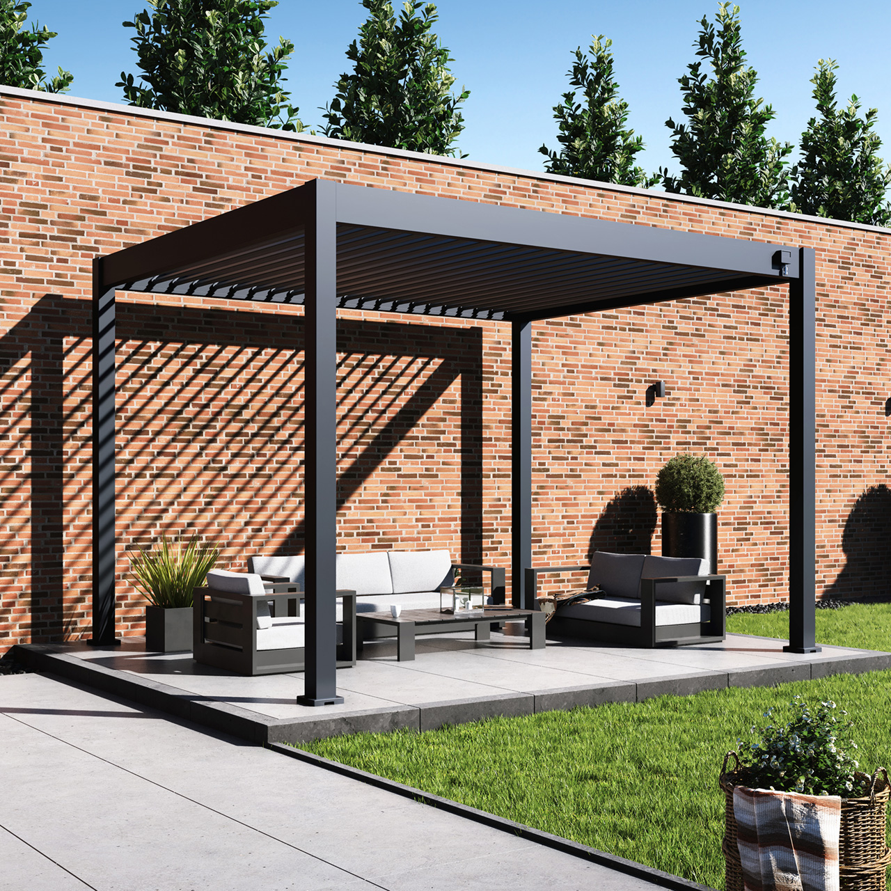 Modern outdoor patio with shaded seating area and brick wall backdrop.