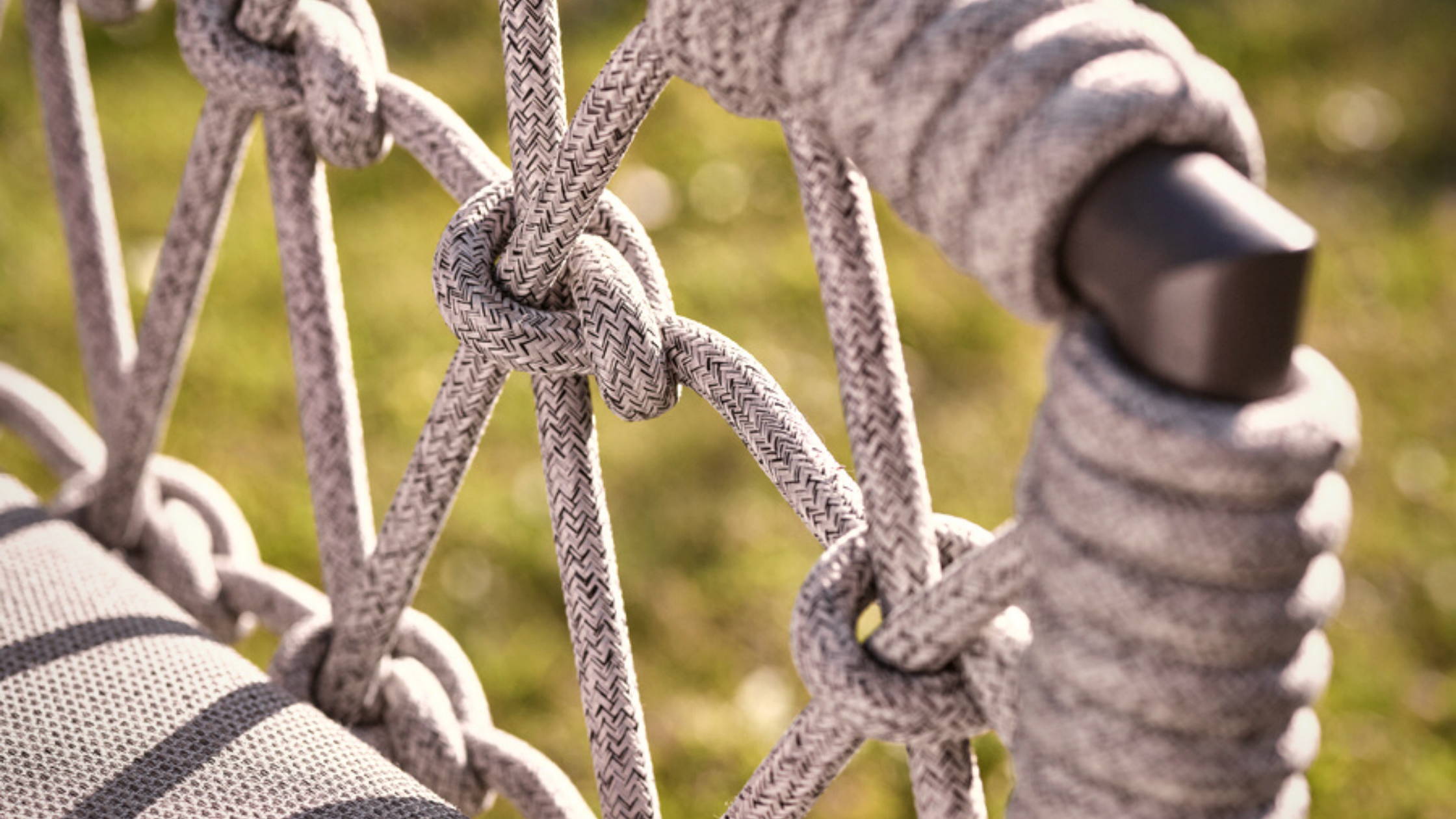 A close up of rope garden furniture.