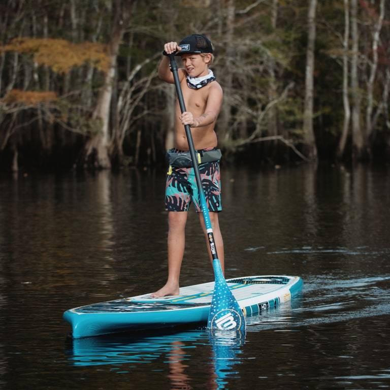 Boy paddling on the HD Native Whale Shark Paddle Board