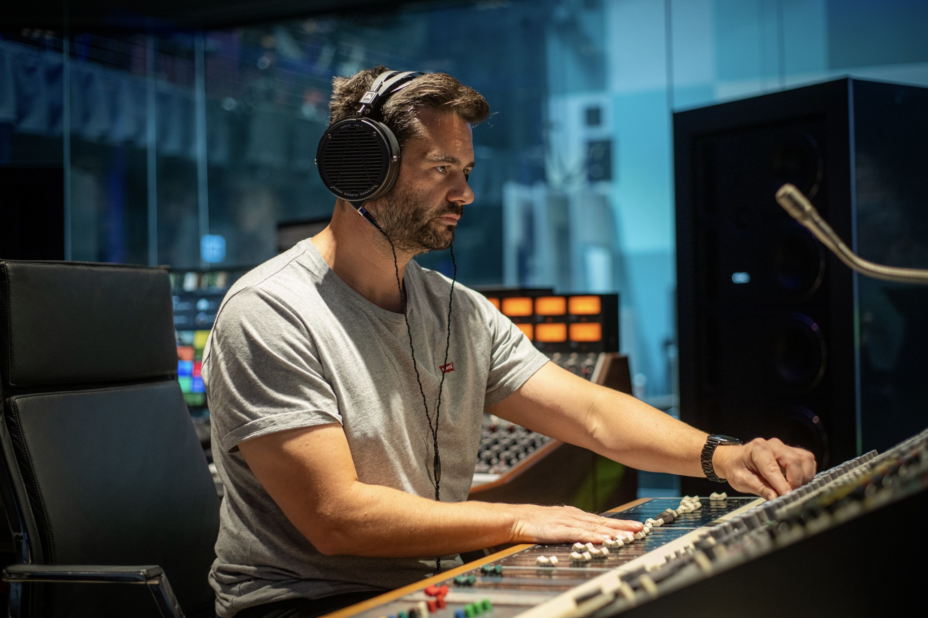 Phil Parsons wearing Audeze LCD-X headphones mixing in the studio 