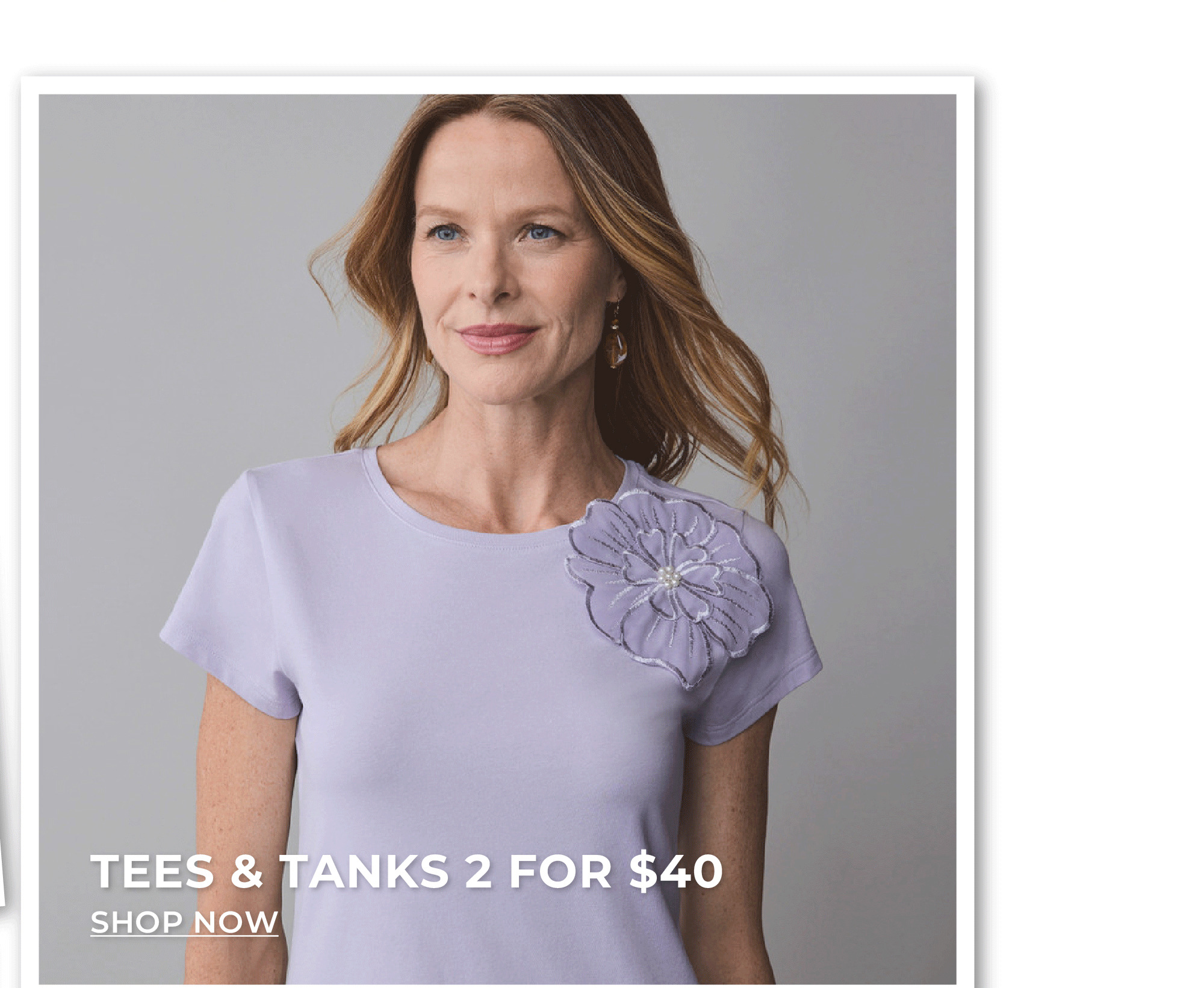 Woman in purple floral t-shirt. Tees and tanks 2 for $40.