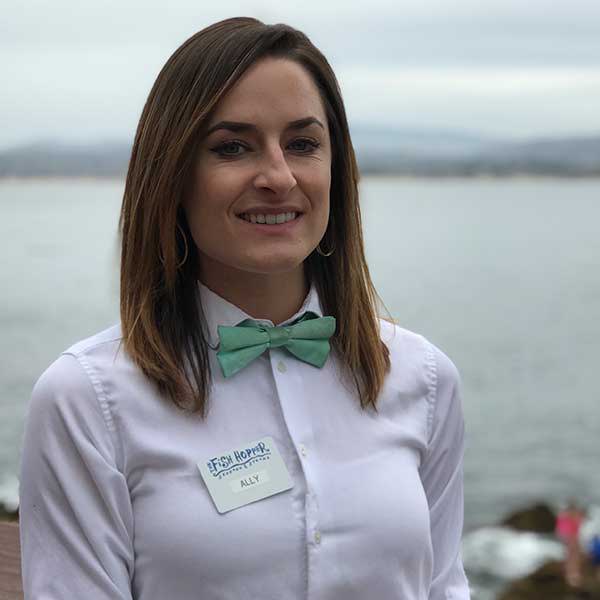 Waitress wearing a seafoam bow tie
