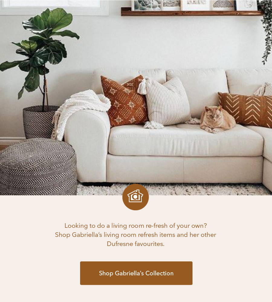 Cream sectional sofa and chevron pouf.