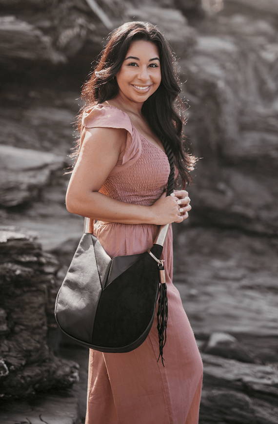 woman wearing black crossbody bag