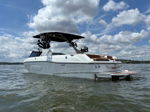 Side profile Ryan's Malibu Wakesetter with Surf Gate swim platform on the lake photo 3