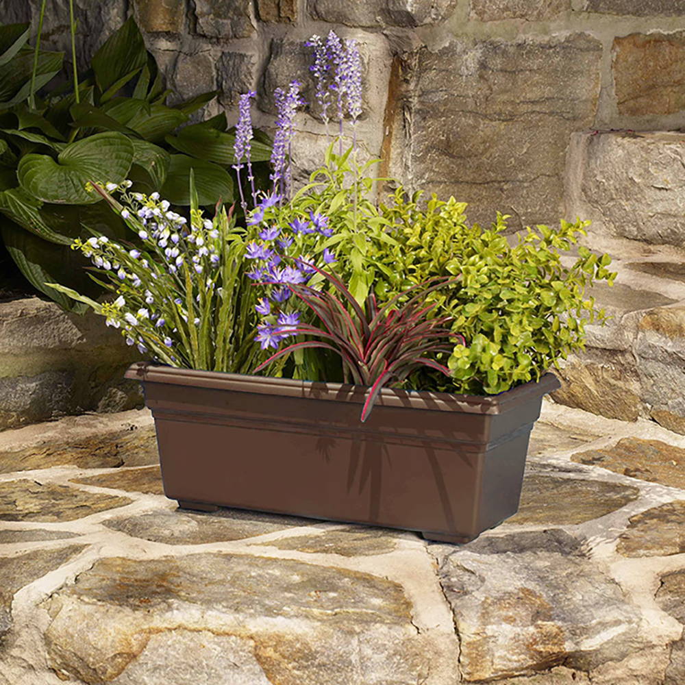 Plants in a brown Countryside patio planter