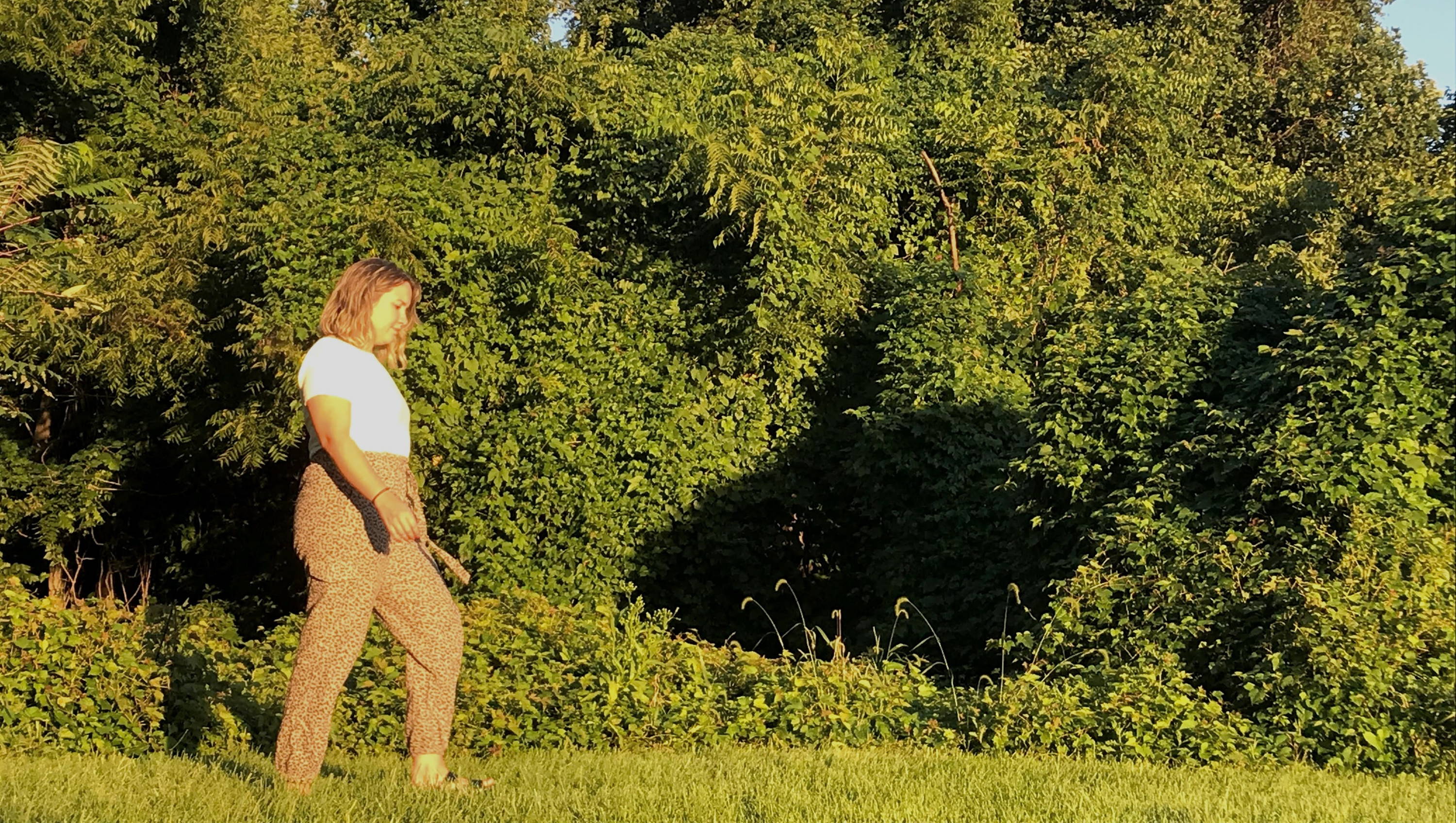 woman wearing an ONNO t shirt in the woods