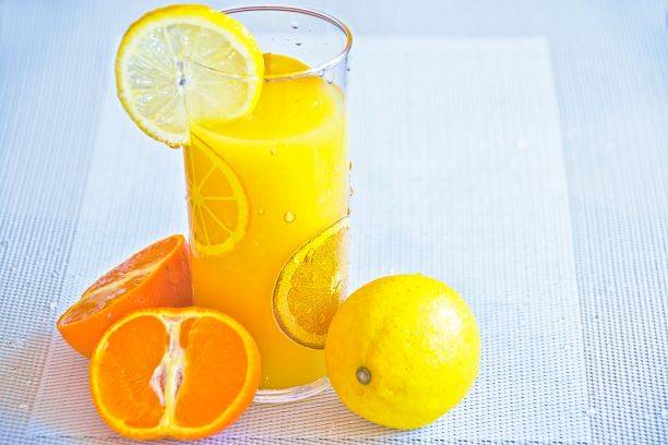 Glass Of Orange Juice With Lemon