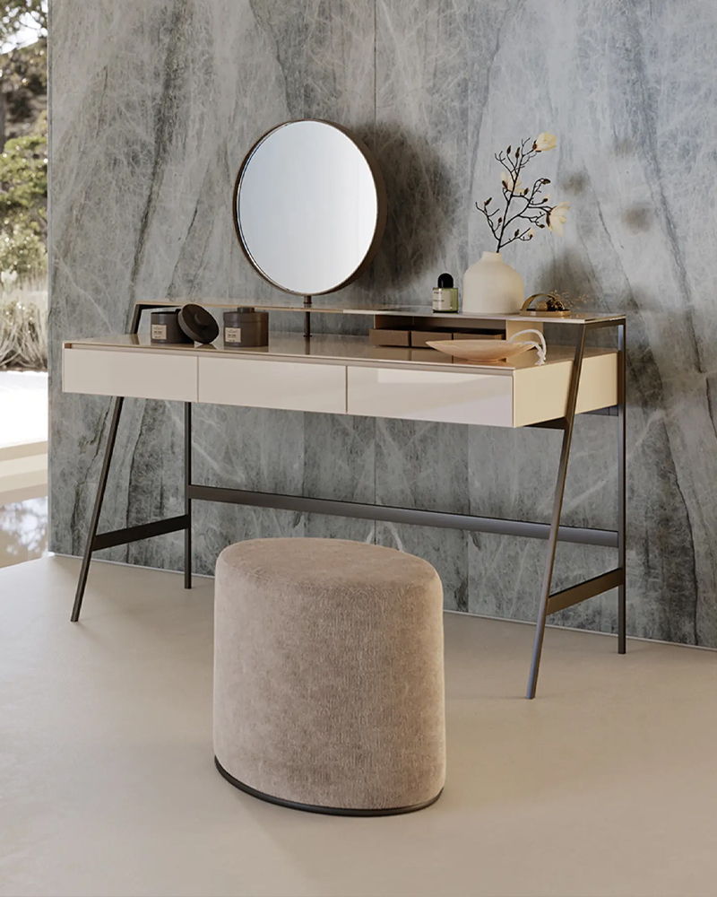 A modern Venere dressinh table by Gallotti and Radice with a round mirror and a plush stool.