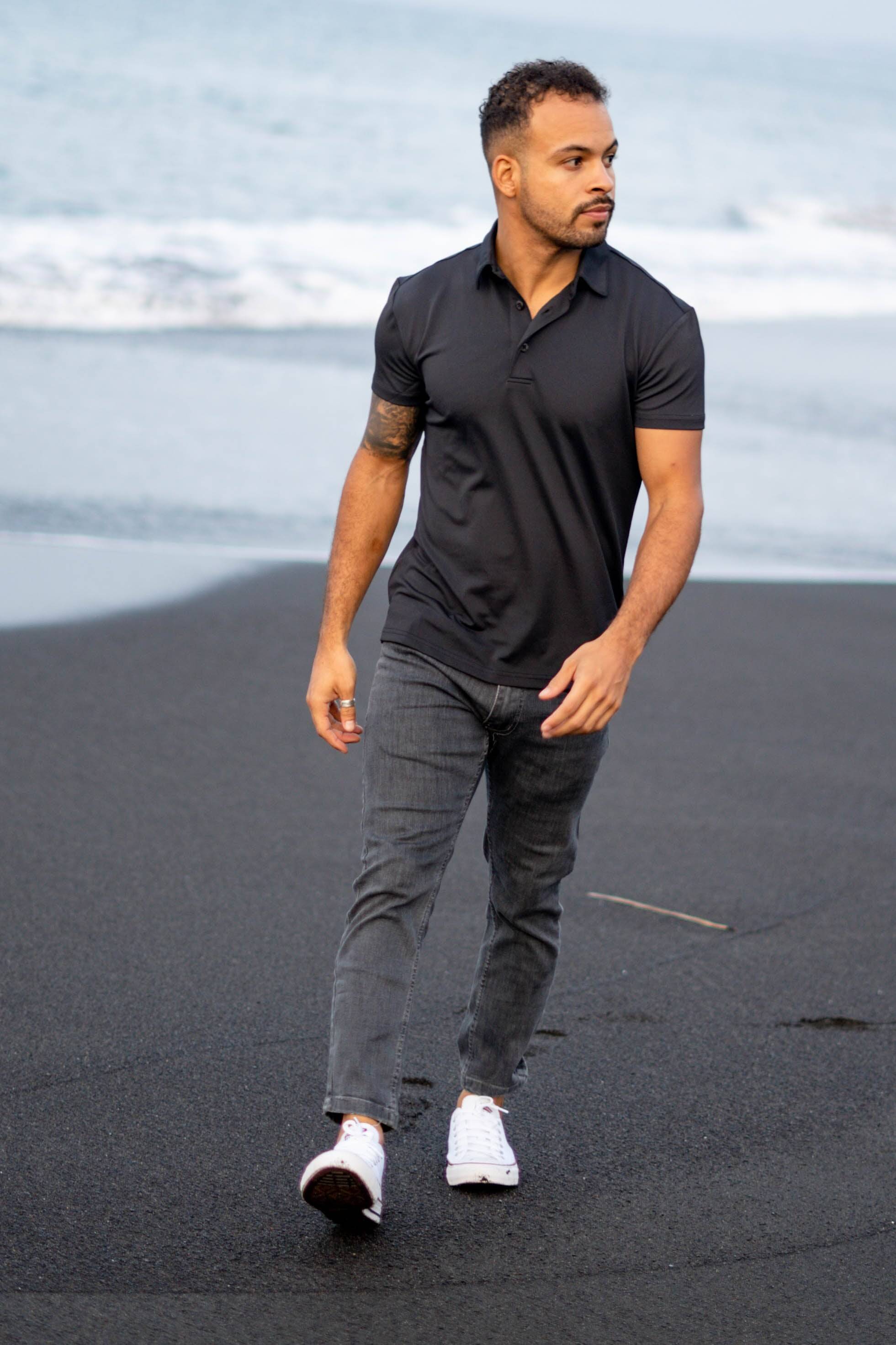 Short man wearing a Performance Pique Black Polo Shirt 