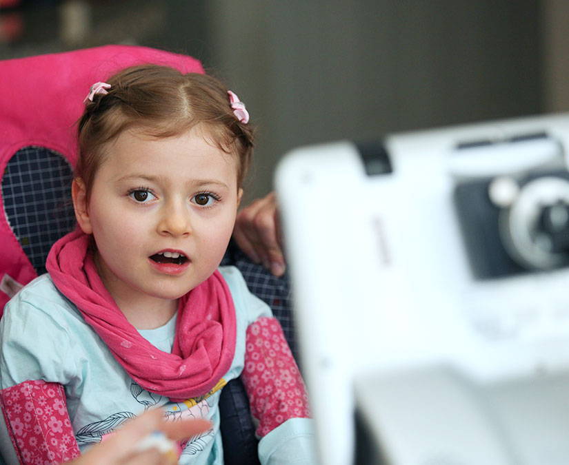 Child using her learned eye gaze skills to communicate