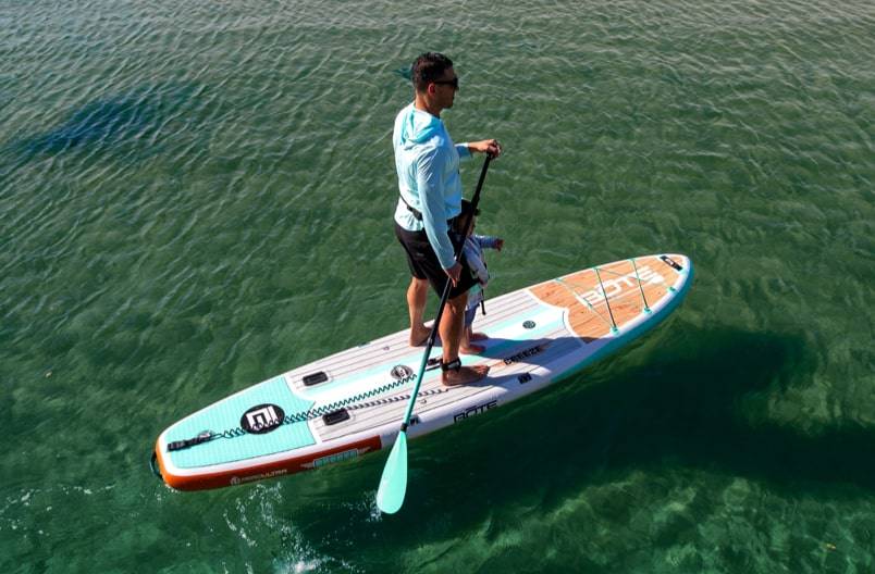 A woman paddling on a Breeze Aero Inflatable Paddle Board