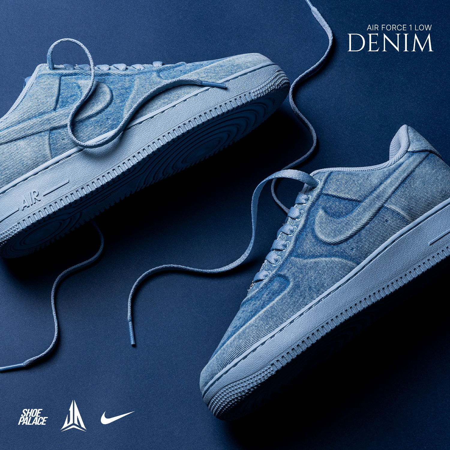 Denim Nike sneakers on a blue background with laces.