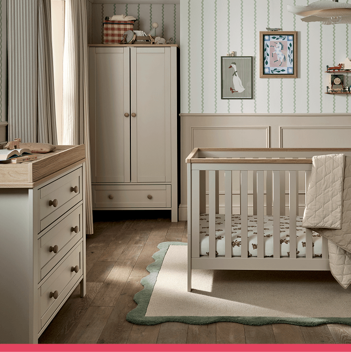 A cozy nursery with a crib, dresser, and decorative wall art.