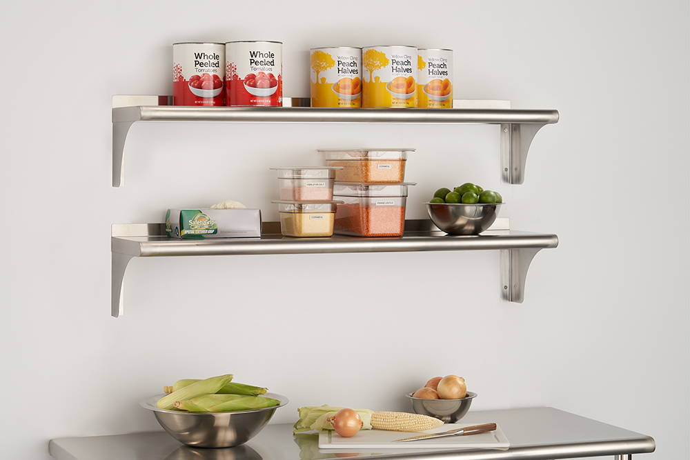 a paid of wall shelves on wall in kitchen