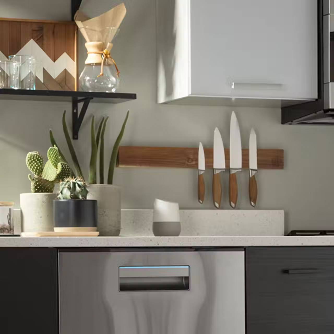 Modern kitchen countertop with Alexa and a Haier dishwasher below it.
