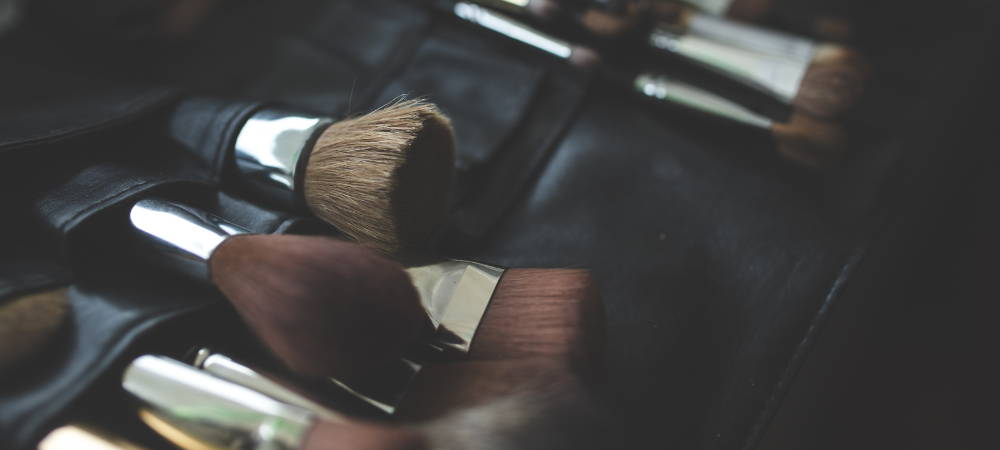 How often should you wash your makeup brushes and with what products