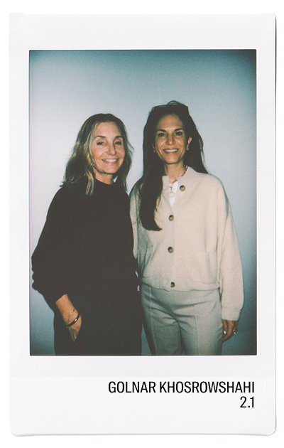 Two women smiling together in a photo booth style image.
